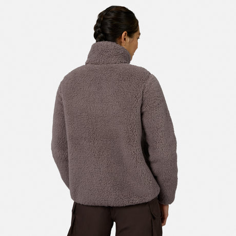 [Model is wearing size S.] A woman shown from the back wearing a textured, sherpa fleece pullover jacket in a muted taupe-brown color, paired with dark brown pants, against a plain light gray studio background.