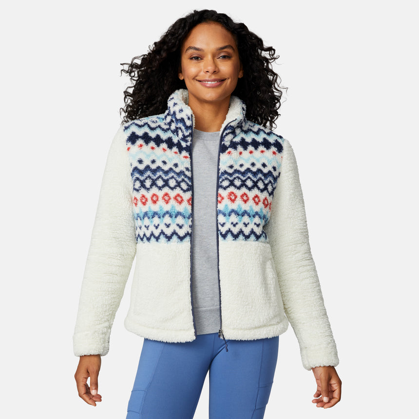 [Angelique is 5'10" wearing size S.] Woman wearing a white fleece jacket with a colorful patterned front panel on a light gray background