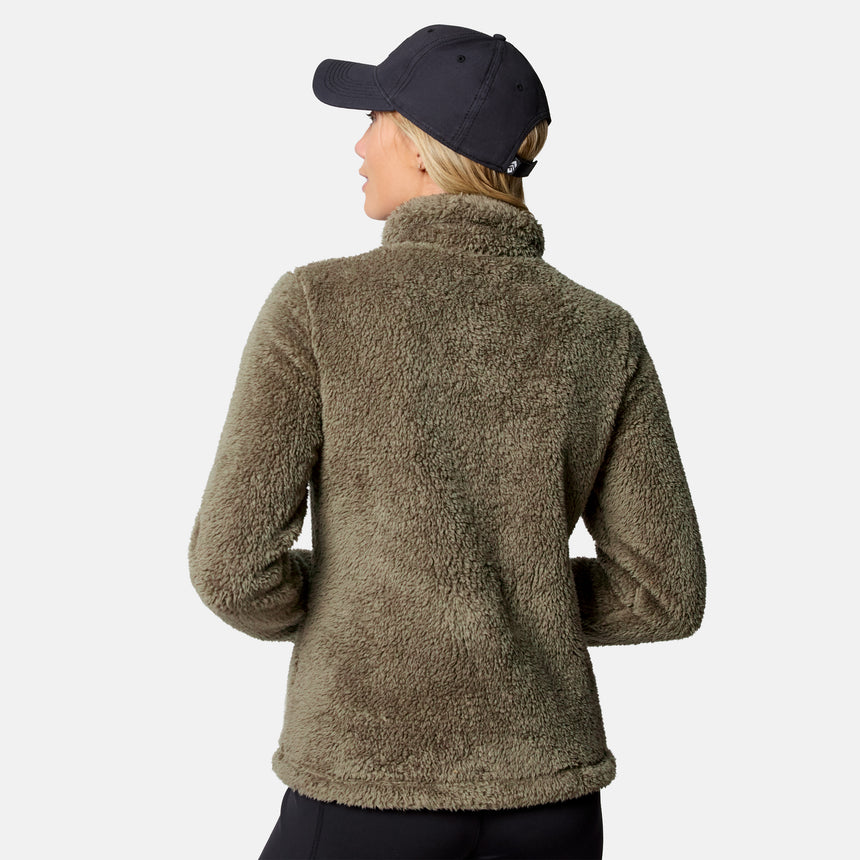Back view of a woman in the Women's Sierra Sherpa Pile Zip Up Jacket showing its fluffy texture