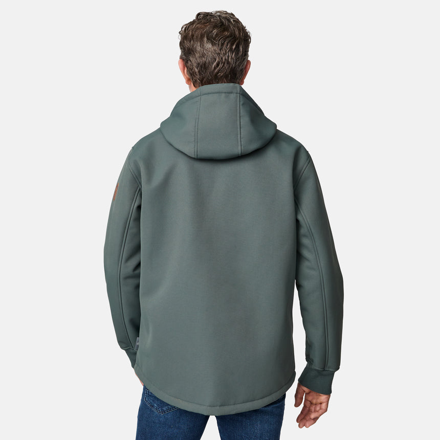 [Kolby is 6'2" wearing size M.] Men’s Free Country green hooded jacket featuring full front zipper, two side pockets, and zippered chest pocket. Includes utility patch on left sleeve and subtle brand label at lower hem. Styled with blue jeans for a laid-back cold-weather look highlighting functional design and casual edge.