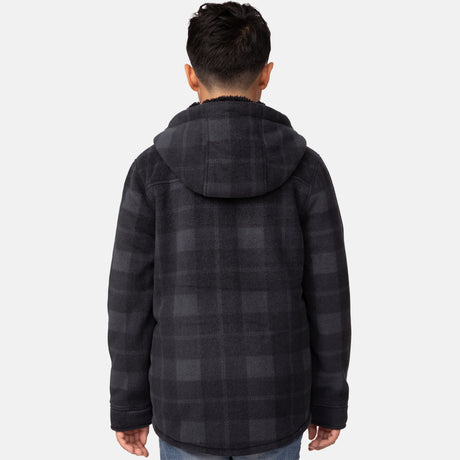 [Model is wearing a size Medium.] Boy wearing the Free Country Boys' Chill Out Fleece Jacket in red and grey plaid with a hood, standing with hands in jeans pockets against a plain light gray background.