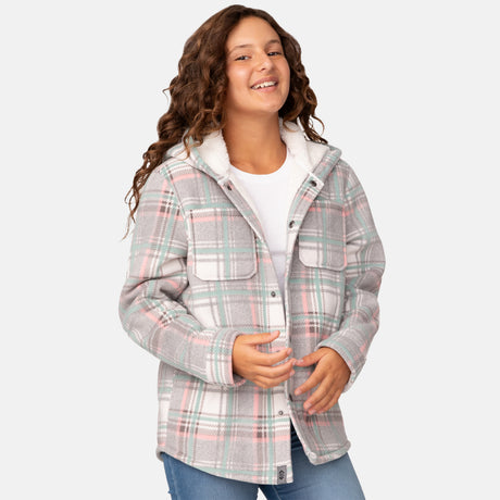 [Model is wearing a size Medium.] Girl wearing the Free Country Girls' Chill Out Fleece Jacket in teal, pink, and grey plaid with a hood, standing with hands in jeans pockets against a plain light gray background.