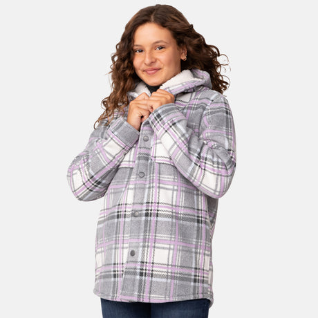 [Model is wearing a size Medium.] Girl wearing the Free Country Girls' Chill Out Fleece Jacket in purple and grey plaid with a hood, standing with hands in jeans pockets against a plain light gray background.