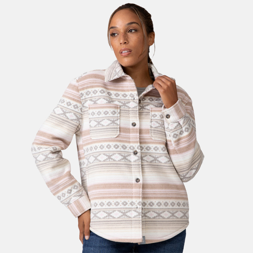 [Shelby is 5'9" wearing a size Small.] Woman wearing the Free Country Women's Chill Out Fleece Shirt Jacket in grey and pink aztec pattern, light-colored background.