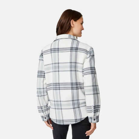 [Jessica is 5'9.5" wearing size S.] Woman wearing a plaid shirt on a white background