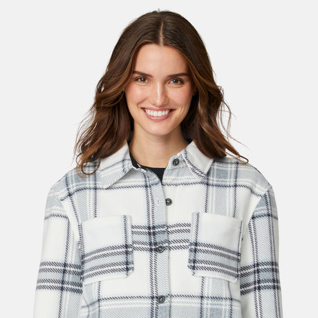 [Jessica is 5'9.5" wearing size S.] Woman wearing a plaid shirt on a white background