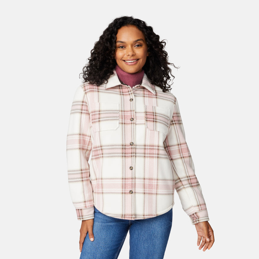 [Angelique is 5'10" wearing size S.] Woman wearing a pink plaid shirt over a turtleneck with a white background