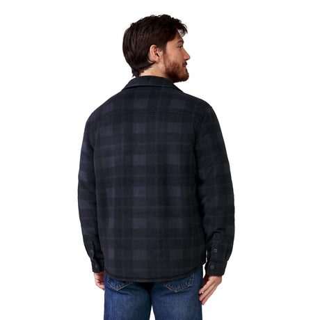 A man seen from behind wearing a black and gray plaid Men’s Chill Out Fleece Shirt Jacket and blue jeans.