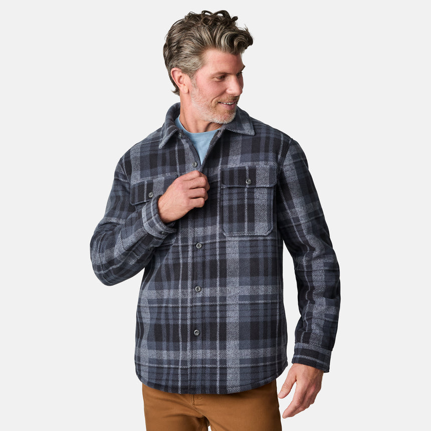 [Kolby is 6'2" wearing size M.] Men’s long-sleeve plaid shirt in dark blue and gray with button front and dual chest pockets — classic outdoor style