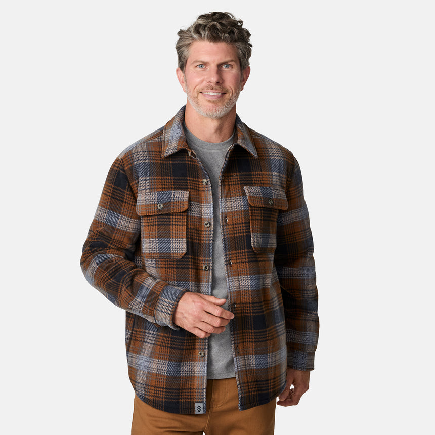 [Kolby is 6'2" wearing size M.] Men’s long-sleeve plaid button-up shirt in brown, black, and gray — features dual chest pockets with button closures and a relaxed fit