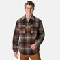 [Kolby is 6'2" wearing size M.] Men’s long-sleeve plaid button-up shirt in brown, black, and gray — features dual chest pockets with button closures and a relaxed fit