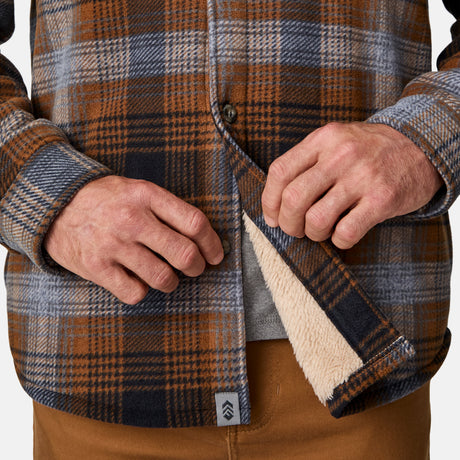 [Kolby is 6'2" wearing size M.] Men’s long-sleeve plaid button-up shirt in brown, black, and gray — features dual chest pockets with button closures and a relaxed fit