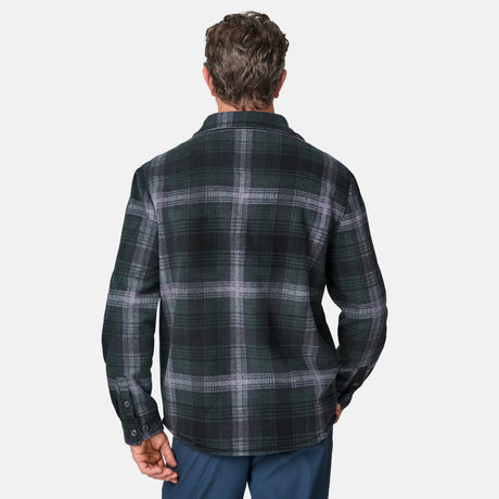 [Kolby is 6'2" wearing size M.] Men’s dark green and black plaid button-up shirt with flap chest pockets and button closures — rugged style with structured fit