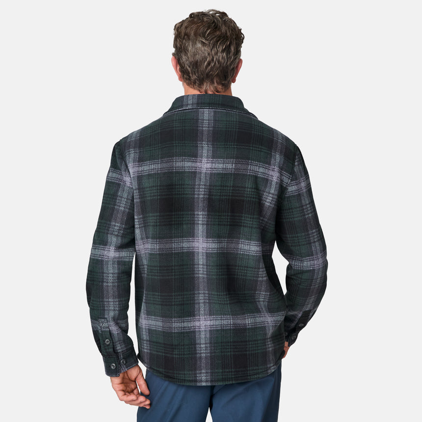 [Kolby is 6'2" wearing size M.] Men’s dark green and black plaid button-up shirt with flap chest pockets and button closures — rugged style with structured fit