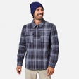 [Model is wearing size M.] A man wearing a navy blue beanie and a navy and gray plaid zip-up flannel shirt jacket, paired with beige pants, against a light gray background.