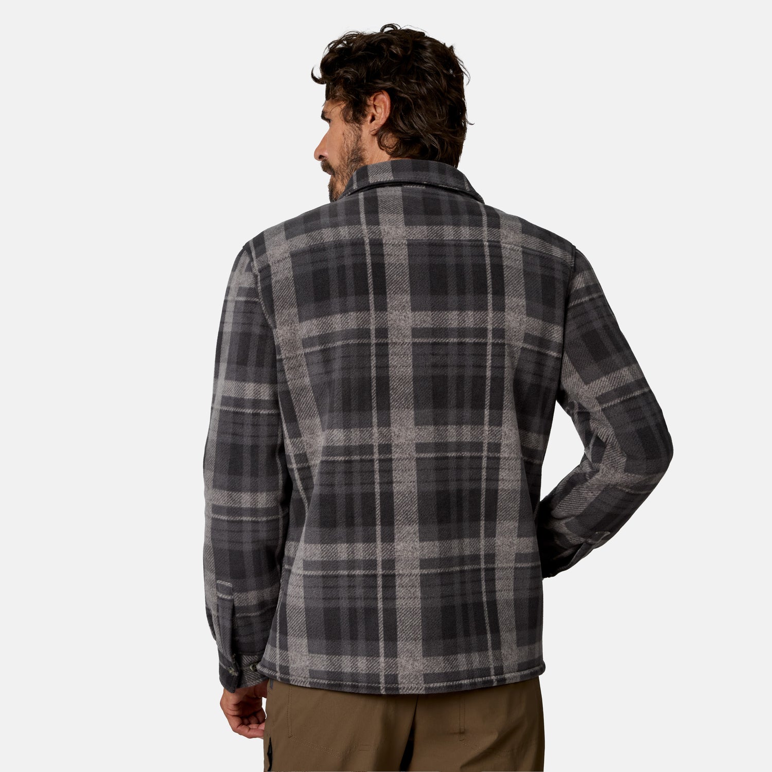 [Model is wearing size M.] A man shown from the back wearing a dark gray and black plaid flannel shirt, paired with brown pants, against a light gray studio background.