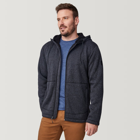 [Joe is 6'0" wearing size M.] Man wearing a black textured hooded jacket on a white background