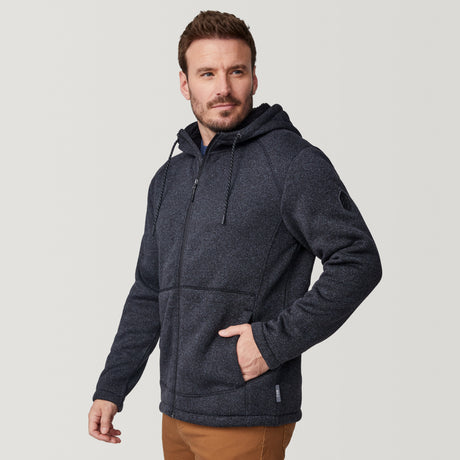 [Joe is 6'0" wearing size M.] Man wearing a black textured hooded jacket on a white background
