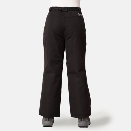 A child wearing Free Country Kids' Padded Ski Pant in black and gray shoes stands with their back to the camera against a plain white background.