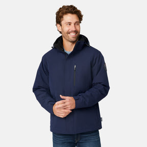 [Matt is 6'2" wearing size M.] Man wearing Free Country Men's Ski Patrol 3-in-1 Systems Jacket in dark navy with a full front zipper opening, an outer jacket for wind and cold weather, an inner puffer jacket, and wind resistant and water resistant stretch performance fabric, light grey background. Perfect men’s jacket for winter weather.