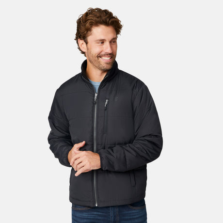 [Matt is 6'2" wearing size M.] Man wearing Free Country Men's Ski Patrol 3-in-1 Systems Jacket in dark navy with a full front zipper opening, an outer jacket for wind and cold weather, an inner puffer jacket, and wind resistant and water resistant stretch performance fabric, light grey background. Perfect men’s jacket for winter weather.