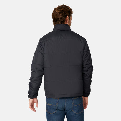 [Matt is 6'2" wearing size M.] Man wearing Free Country Men's Ski Patrol 3-in-1 Systems Jacket in dark navy with a full front zipper opening, an outer jacket for wind and cold weather, an inner puffer jacket, and wind resistant and water resistant stretch performance fabric, light grey background. Perfect men’s jacket for winter weather.