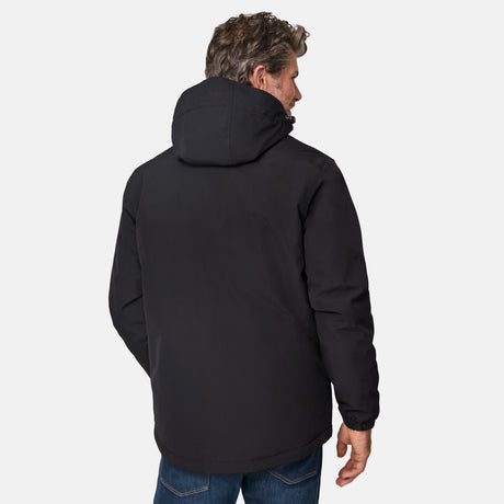 [Kolby is 6’2” wearing size M.] Men’s Free Country black zip-front jacket with hood, zippered side pockets, and subtle logo on the left chest—layered over a green crewneck tee and paired with blue jeans for versatile, cool-weather wear.