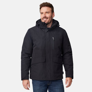 [Joe is 6’0” wearing size M.] Man wearing Free Country Men's Ski Patrol 3-in-1 Systems Jacket in black with a full front zipper opening, an outer jacket for wind and cold weather, an inner puffer jacket, and wind resistant and water resistant stretch performance fabric, light grey background. Perfect men’s jacket for winter weather.