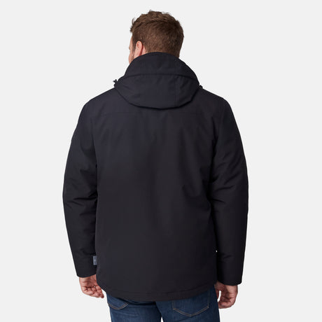 [Joe is 6’0” wearing size M.] Man wearing Free Country Men's Ski Patrol 3-in-1 Systems Jacket in black with a full front zipper opening, an outer jacket for wind and cold weather, an inner puffer jacket, and wind resistant and water resistant stretch performance fabric, light grey background. Perfect men’s jacket for winter weather.