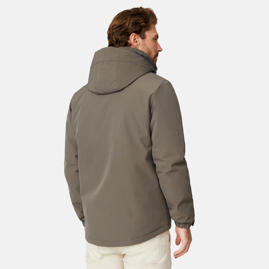 [Matt is 6'2" wearing size M.] Men’s Free Country brown zip-front hooded jacket with chest pocket and angled side pockets—layered over a gray crewneck shirt and beige pants for a casual, lightweight outdoor look.