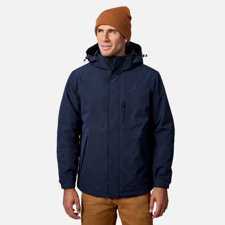 Male model wearing navy Denali insulated jacket and brown knit beanie against a white background