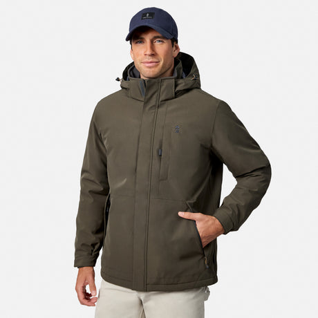 Profile of a man wearing an olive Denali insulated jacket with hood and navy cap.
