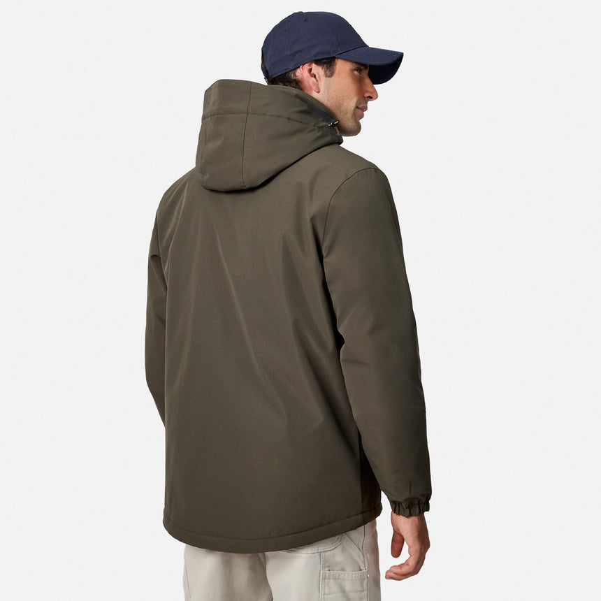 Side view of man in olive Denali Insulated Jacket with hood down and navy cap.
