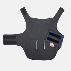 The Brawny Canvas Reversible Dog Work Jacket by Clearance is a black fabric vest with two front pockets, velcro straps on the sides and shoulders, and a detachable blue velcro accessory, shown on a white background.