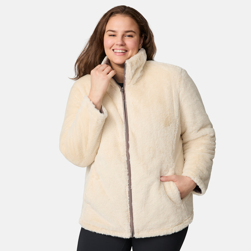 [Karissa is 5'9.5" wearing size 1X.] Woman wearing a brown quilted reversible Free Country jacket on a white background