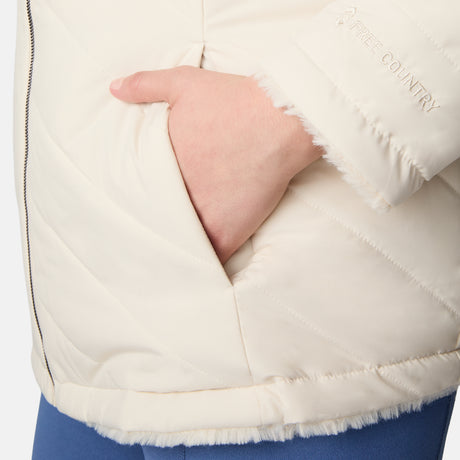 [Karissa is 5'9.5" wearing size 1X.] Woman wearing a cream quilted reversible Free Country jacket on a white background