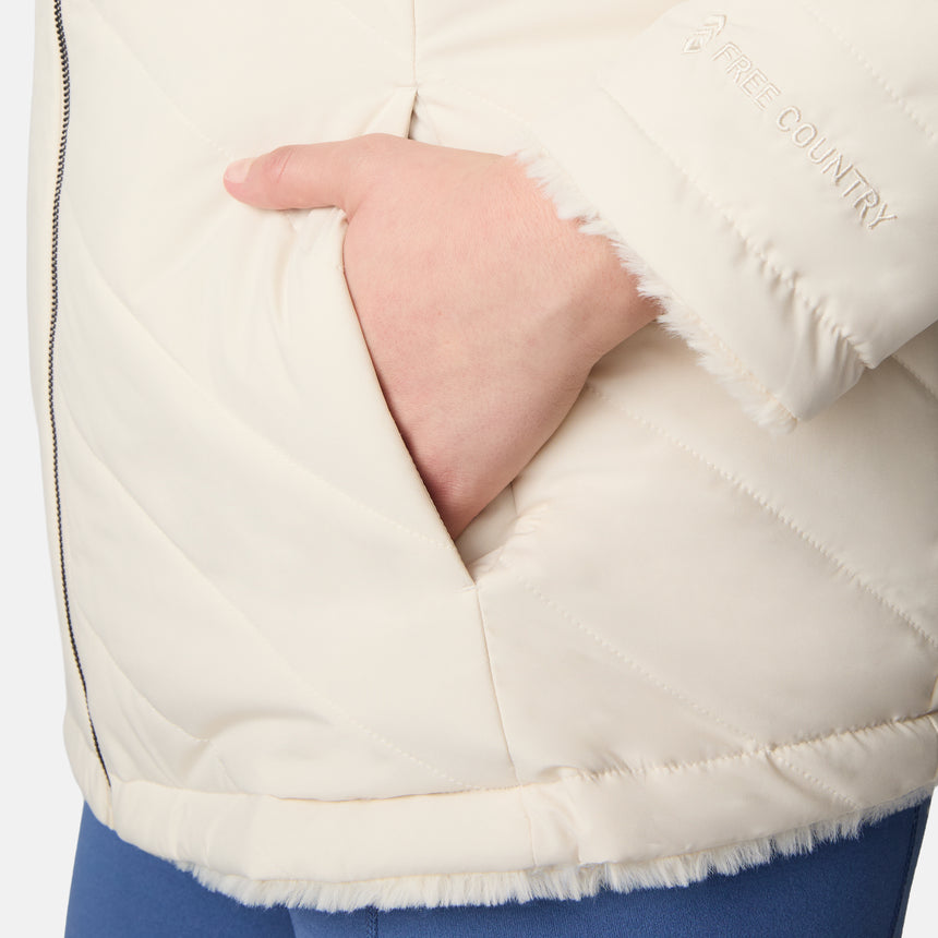 [Karissa is 5'9.5" wearing size 1X.] Woman wearing a cream quilted reversible Free Country jacket on a white background