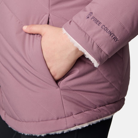 Close-up of a person wearing the Women's Plus Size Cirrus Quilted Reversible Jacket by Clearance, featuring mauve color, soft white lining, recycled polyester, and brand embroidery near the cuff for added style and sustainability.