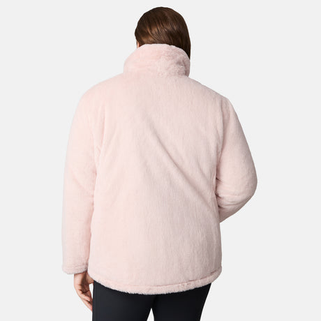 A woman with brown hair is seen from the back wearing the Women's Plus Size Cirrus Quilted Reversible Jacket by Clearance in light pink and black pants, against a plain light gray background.