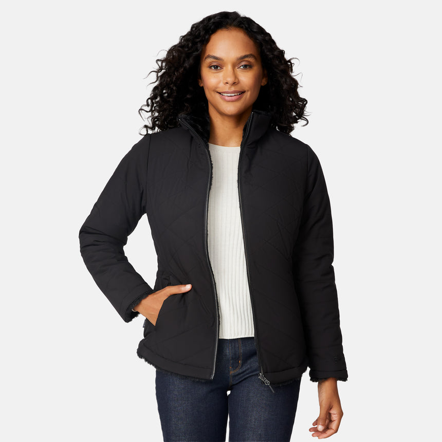 [Angelique is 5'10" wearing size S.] Woman wearing a black quilted reversible Free Country jacket on a white background