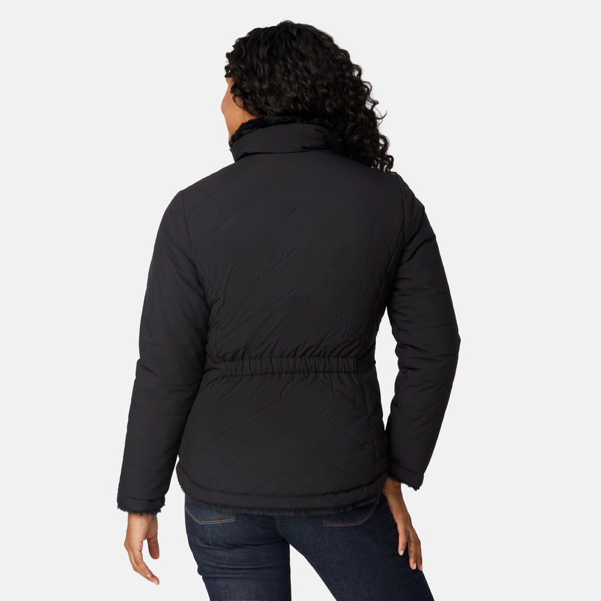 [Angelique is 5'10" wearing size S.] Woman wearing a black quilted reversible Free Country jacket on a white background
