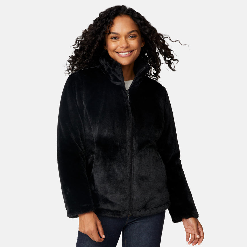 [Angelique is 5'10" wearing size S.] Woman wearing a black quilted reversible Free Country jacket on a white background