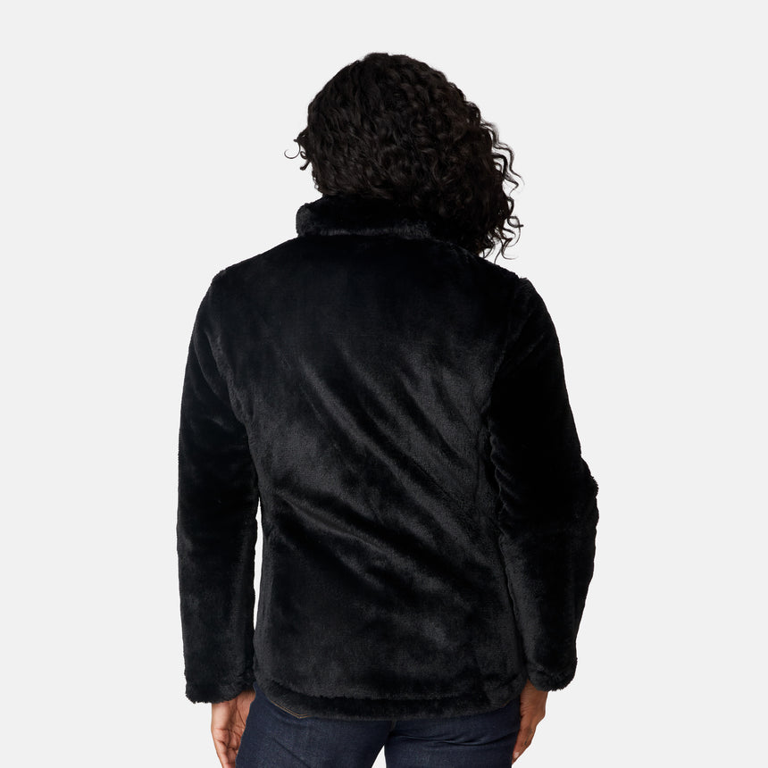 [Angelique is 5'10" wearing size S.] Woman wearing a black quilted reversible Free Country jacket on a white background