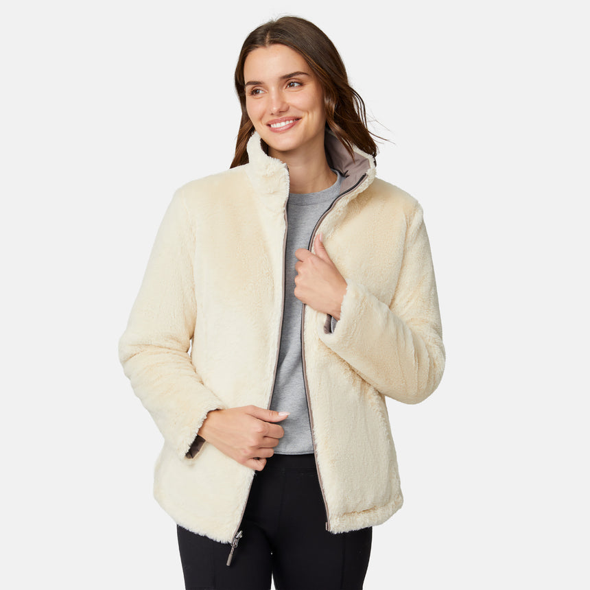 [Jessica is 5'9.5" wearing size S.] Woman wearing a brown quilted reversible Free Country jacket on a white background