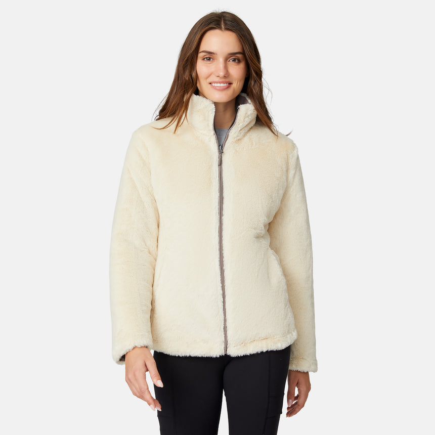 [Jessica is 5'9.5" wearing size S.] Woman wearing a brown quilted reversible Free Country jacket on a white background