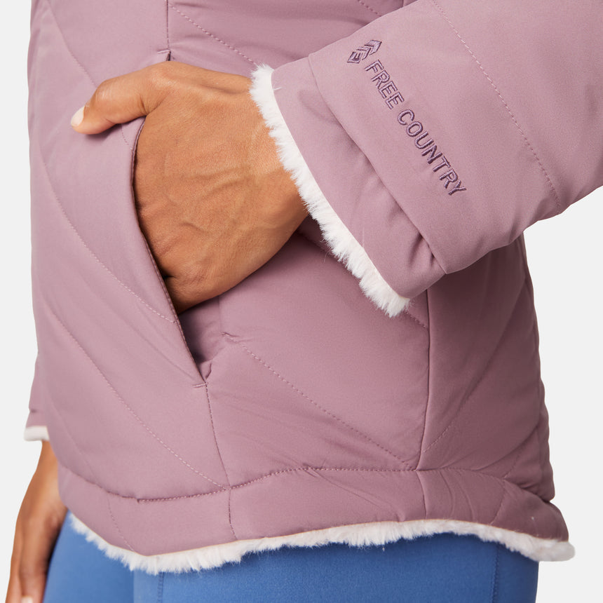 [Angelique is 5'10" wearing size S.] Close-up of a pink quilted jacket with white fur trim, featuring the 'Free Country' brand.
