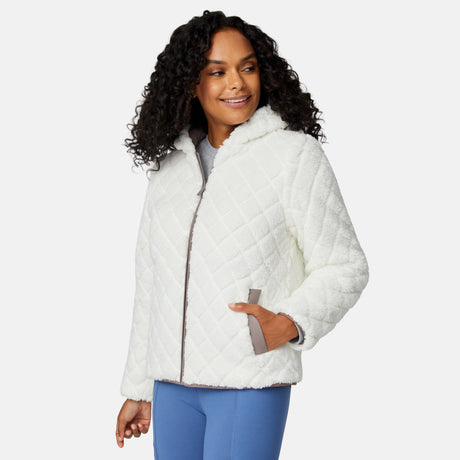 [Angelique is 5'10" wearing size S.] Light brown quilted reversible jacket with fleece-lined hood, zip front, and pockets; worn over grey shirt and blue pants.