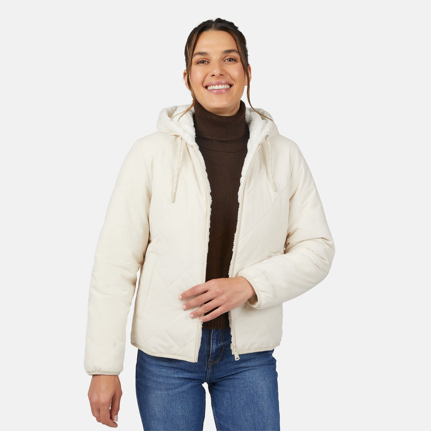 [Olga is 5'9" wearing size S.] Light quilted hooded jacket with zip front and padded warmth; styled over dark turtleneck and blue jeans.