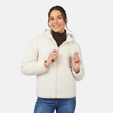 [Olga is 5'9" wearing size S.] Light quilted hooded jacket with zip front and padded warmth; styled over dark turtleneck and blue jeans.
