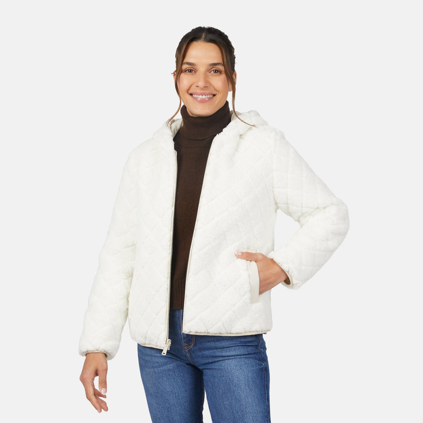 [Olga is 5'9" wearing size S.] Light quilted hooded jacket with zip front and padded warmth; styled over dark turtleneck and blue jeans.